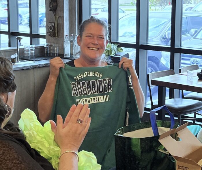Lana with a Saskatchewan RoughRider Hoodie