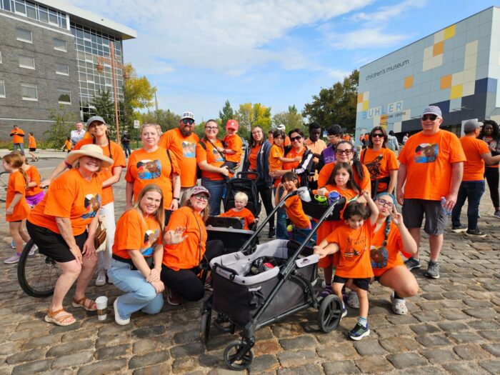SCE LifeWorks staff wearing custom Orange Day Shirts designed by ZC